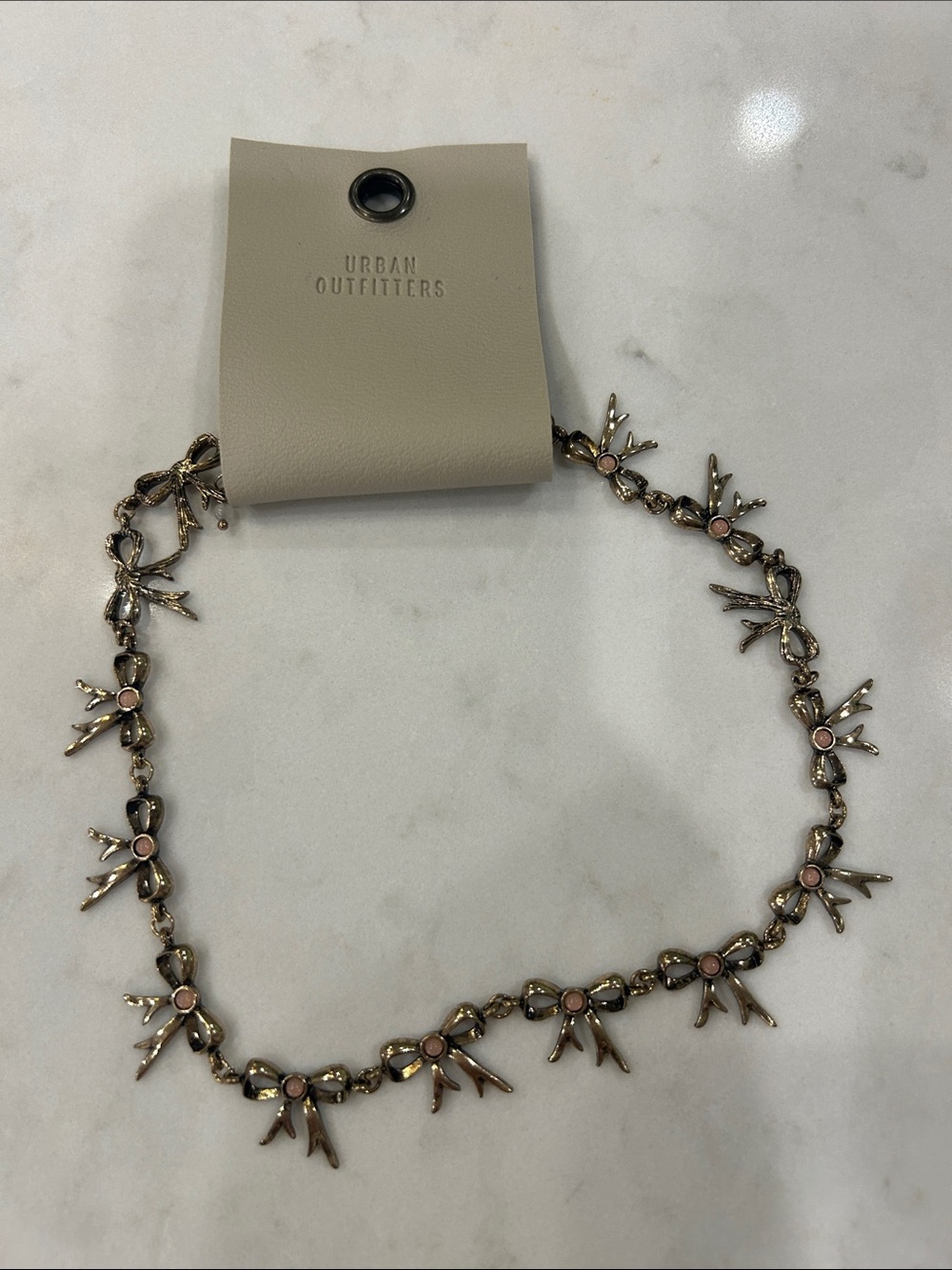 Urban Outfitters Gold-Tone Necklace with Pink Crystal Accents. Ribbons 🎀